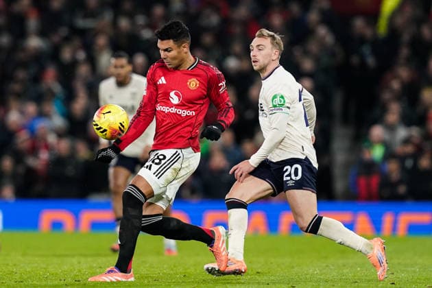 Manchester, England, 4th December 2025. Casemiro of Manchester United, ManU controls the ball during the Manchester United vs West Ham United Premier League match at Old Trafford, Manchester. Picture credit should read: Andrew Yates Sportimage EDITORIAL USE ONLY. No use with unauthorised audio, video, data, fixture lists, club league logos or live services. Online in-match use limited to 120 images, no video emulation. No use in betting, games or single club league player publications. SPI_033_AY_MANUTD_WESTHAM SPI-4345-0034