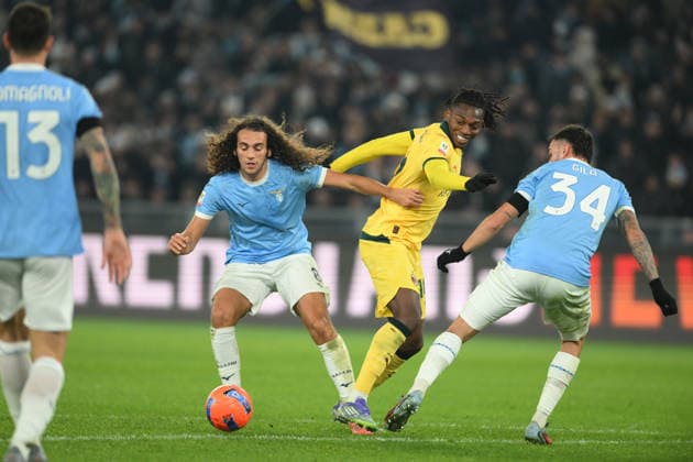 4th December 2025, Stadio Olimpico, Rome, Italy; Italian Coppa Italia Football; Lazio versus AC Milan; Rafael Leao of AC Milan under pressure from Pedro of SS Lazio, and Mario Gila of SS Lazio  AllShotLive