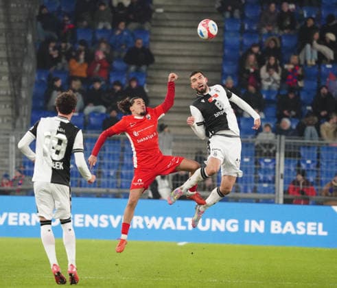04 12 2025 Basel Switzerland Soccer Men Season 2025 2026 Cup FC Basel FC Grand Saconnex 3 1 Picture Yannis Sghaier FC Grand Saconnex vs Adrian Barisic FC Basel in header duel r action duel