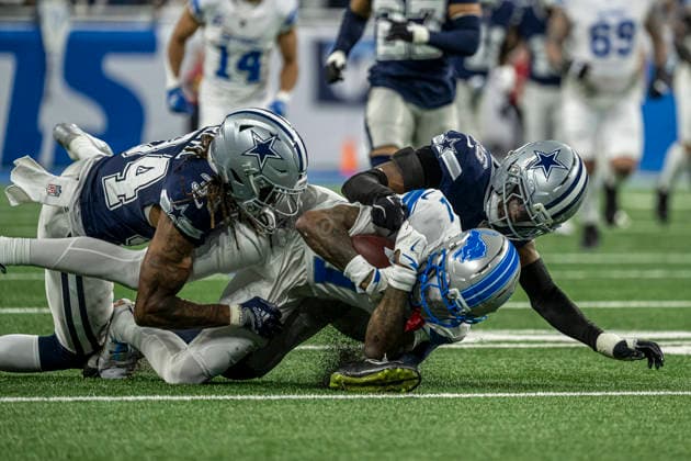 DETROIT, MI - DECEMBER 04: Detroit Lions Wide Receiver Jameson Williams (1) gets tackled by Dallas Cowboys CB Shavon Revel Jr. (34) and Dallas Cowboys CB DaRon Bland (26) during the game between Dallas Cowboys and Detroit Lions on December 4, 2025 at Ford Field in Detroit, MI ( CSM) Detroit United States - ZUMAc04_ 20251204_zma_c04_004 Copyright: xAllanxDranbergx