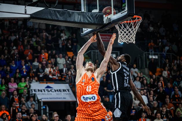 Christian Sengfelder ratiopharm ulm and Selom Mawugbe Dolomiti Energia Trento battle for the ball during the Basketball Eurocup match between ratiopharm ulm and Dolomiti Energia Trento at ratiopharm Arena on December 4, 2025 in Neu Ulm, Germany Photo by Harry Langer DeFodi Images