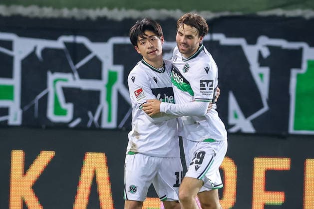 05 12 2025, Football, Preußen Münster Hannover 96, 2 Fußball Bundesliga, Preußenstadion, Saison 2025 2026 Goal celebration after the goal to 2 0 by scorer Daisuke Yokota Hannover96 18 next to Kolja Oudenne Hannover96 29 DFB regulations prohibit any use of photographs as image sequences and or quasi video Nordrhein Westfalen Germany