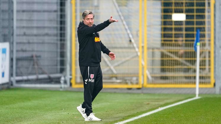 Michael Wimmer coach, head coach, Regensburg , gives instructions, gestures, gesticulates with arms, cropped image, full body, single image, single photo, action, action, on the sidelines, 06 12 2025, Sinsheim Germany , Football, 3 Liga, TSG 1899 Hoffenheim II SSV Jahn Regensburg, DFB DFL REGULATIONS PROHIBIT ANY USE OF PHOTOGRAPHS AS IMAGE SEQUENCES AND OR QUASI VIDEO xozx