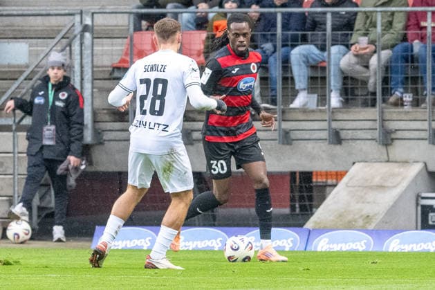 06 12 25, Soccer 3 Liga, Season 2025 2026, Matchday 17, Viktoria Koeln SSV Ulm 1846 at Sportpark Hoehenberg duel between Max Scholze SSV Ulm 1846, 28 and Yannik Aime Tonye Viktoria Koeln, 30 Important note According to the regulations of the DFL German Football League and the DFB German Football Association, it is prohibited, to utilize or have utilized photographs taken in the stadium and or of the match in the form of sequential images and or video-like photo series Foto Kirchner Media Thomas Haesler Copyright: xKirchner-Media ThomasxHaeslerx