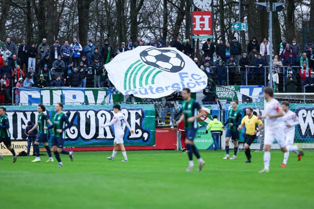 06 12 2025, xKWIx, Football, Regionalliga West, FC Gütersloh RW Oberhausen, Ohlendorf Stadion im Heidewald FC Gütersloh fans present the old logo in the block Photo xKamilxWilkowskixPressefotoKochx NRW Germany