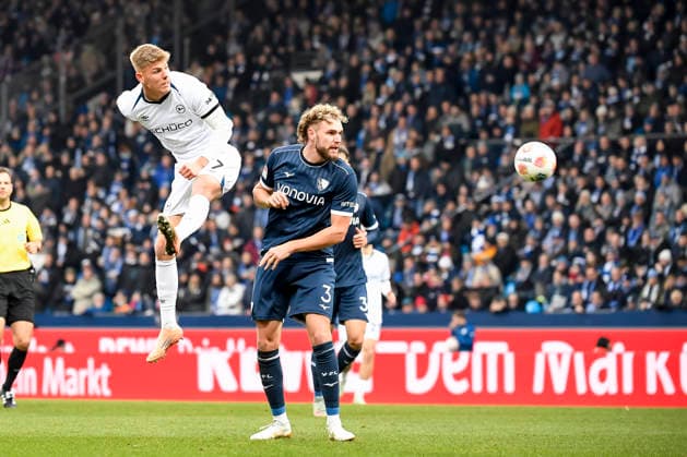 Julian Kania Arminia Bielefeld and Philipp Strompf VfL Bochum battle for the ball during the 2 Bundesliga match between VfL Bochum and Arminia Bielefeld, Vonovia Ruhrstadion on December 06, 2025 in Bochum, Germany Photo by Max Maiwald DeFodi Images Julian Kania Arminia Bielefeld and Philipp Strompf VfL Bochum battle for the ball during the 2 Bundesliga match between VfL Bochum and Arminia Bielefeld at Vonovia Ruhrstadion on December 6, 2025 in Bochum, Germany Photo by Max Maiwald DeFodi Images DFB DFL REGULATIONS PROHIBIT ANY USE OF PHOTOGRAPHS AS IMAGE SEQUENCES AND OR QUASI VIDEO Photo by Max Maiwald DeFodi Images