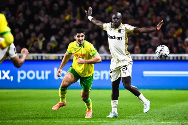 FOOTBALL : FC Nantes vs RC Lens - Ligue 1 - JournÃ e 15 - 06 12 2025 Mayckel Lahdo (FC NANTES) Malang Sarr (RC Lens) NantesFrance  Copyright: xBaptistexAutissierx