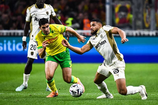 FOOTBALL : FC Nantes vs RC Lens - Ligue 1 - JournÃ e 15 - 06 12 2025 Mayckel Lahdo (FC NANTES) Matthieu Udol (RC Lens) NantesFrance  Copyright: xBaptistexAutissierx