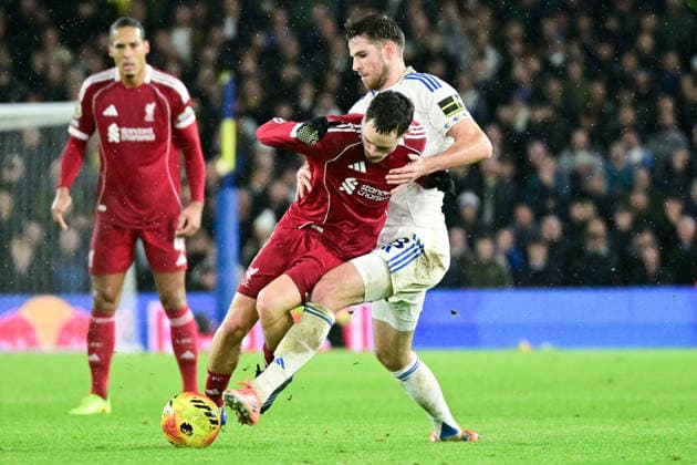 Leeds United v Liverpool Premier League 06 12 2025. Leeds United midfielder Anton Stach (18) tackles Liverpool midfielder Florian Wirtz (7) during the Premier League match between Leeds United and Liverpool at Elland Road, Leeds, England on 6 December 2025. Leeds Elland Road West Yorkshire England Editorial use only DataCo restrictions apply See www.football-dataco.com , Copyright: xDennisxGoodwinx PSI-23360-0035