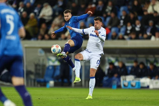 06 12 2025, Soccer 2 Bundesliga, SV Darmstadt 98 Karlsruher SC, emonline, emspor, despor, v l , Fabian Nürnberger SV Darmstadt 98 , Philipp Förster Karlsruher SC DFL DFB REGULATIONS PROHIBIT ANY USE OF PHOTOGRAPHS AS IMAGE SEQUENCES AND OR QUASI VIDEO xdcx Copyright: HMBxMedia Claus