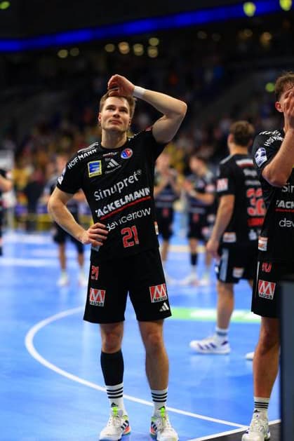 Handball scene with players from HC Erlangen in black jerseys Handball scene with players from HC Erlangen Copyright: xspeedshotx