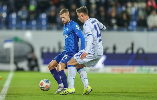 GER, Darmstadt, SV Darmstadt 98 vs Karlsruher SC, 2 Bundesliga, Football, DFB, Season 2025 2026, Merck Stadion am Böllenfalltor, 15 Matchday in the picture from l Fabian Nürnberger SV Darmstadt 98 15 , Philipp Förster Karlsruher SC 11 , Duel DFB DFL REGULATIONS PROHIBIT ANY USE OF PHOTOGRAPHS AS IMAGE SEQUENCES AND OR QUASI VIDEO, 06 12 2025 Copyright: HMBxMedia HendrikxHamelau
