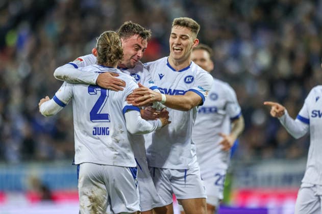 GER, Darmstadt, SV Darmstadt 98 vs Karlsruher SC, 2 Bundesliga, Football, DFB, Season 2025 2026, Merck Stadion am Böllenfalltor, 15 Matchday in picture Karlsruher SC celebrating after Matej Maglicas own goal SV Darmstadt 98 5 , Philipp Förster Karlsruher SC 11 , Sebastian Jung Karlsruher SC 2 , 0 1 DFB DFL REGULATIONS PROHIBIT ANY USE OF PHOTOGRAPHS AS IMAGE SEQUENCES AND OR QUASI VIDEO, 06 12 2025 Copyright: HMBxMedia HendrikxHamelau