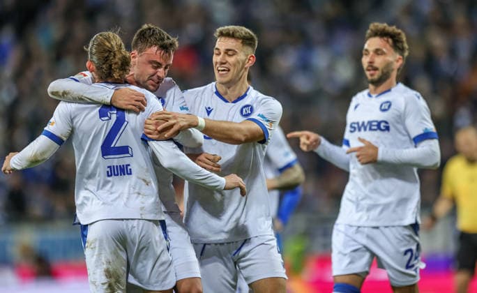 GER, Darmstadt, SV Darmstadt 98 vs Karlsruher SC, 2 Bundesliga, Football, DFB, Season 2025 2026, Merck Stadion am Böllenfalltor, 15 Matchday in picture Karlsruher SC cheer after Matej Maglicas own goal SV Darmstadt 98 5 , Philipp Förster Karlsruher SC 11 , Sebastian Jung Karlsruher SC 2 , 0 1 DFB DFL REGULATIONS PROHIBIT ANY USE OF PHOTOGRAPHS AS IMAGE SEQUENCES AND OR QUASI VIDEO, 06 12 2025 Copyright: HMBxMedia HendrikxHamelau