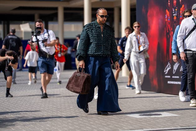Abu Dhabi Grand Prix 2025 - Race Day Lewis Hamilton (Gbr) of Scuderia Ferrari 44 entering the paddock in a Dior fashion attire on Sunday (Race day) during the Formula 1 Etihad Airways Abu Dhabi Grand Prix 2025 at the Yas Marina Circuit on December 7, 2025 . Photo by Antoine Lapeyre ABACAPRESS.COM Abu Dhabi United Arab Emirates  Copyright: xLapeyrexAntoine ABACAx