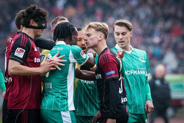 Noel Futkeu 9 Spvgg Greuther Fuerth and Tim Janisch 32 1FC Nuernberg clash, with Fabio Gruber 4 1FC Nuernberg and Luca Itter 27 Spvgg Greuther Fuerth , 1 FC Nuernberg vs Spvgg Greuther Fuerth, Football, 2 Bundesliga, DFL, Season 2025 2026, Hinrunde, 15 Matchday, 07 12 2025 DFB regulations prohibit any use of photographs as image sequences and or quasi video Nuernberg Bayern Germany Copyright: xkolbert-press MartinxAgüerax