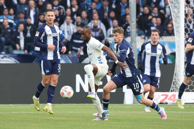 DEU, DFL, 2 FBL, Hertha BSC vs 1 FC Magdeburg, 07 12 2025, Berliner Olympiastadion, Berlin, DEU, DFL, 2 FBL, Hertha BSC vs 1 FC Magdeburg, im Bild Michael Cuisance Hertha BSC Berlin 10 , Paul Seguin Hertha BSC Berlin 30 , Silas Gnaka 1 FC Magdeburg 25 DFL regulations prohibit any use of Photographs as image sequences and or quasi video nordphotoxGmbHx xEngler nph00076