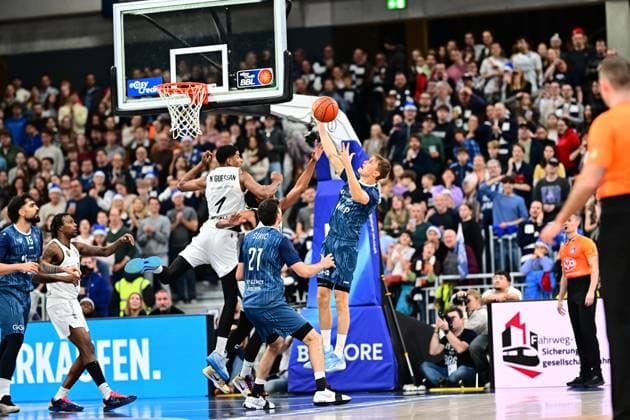 Game action with Josh Hawley 3 Basketball Lions Braunschweig and Marcel Keßen 15 MLP Academics Heidelberg Josh Hawley 3 Basketball Lions Braunschweig with throw Copyright: xMichaelxGelhardtx