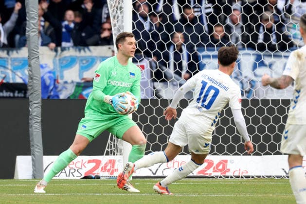DEU, DFL, 2 FBL, Hertha BSC vs 1 FC Magdeburg, 07 12 2025, Berliner Olympiastadion, Berlin, DEU, DFL, 2 FBL, Hertha BSC vs 1 FC Magdeburg, im Bild Tjark Ernst Hertha BSC Berlin 1 , Noah Pesch 1 FC Magdeburg 10 DFL regulations prohibit any use of Photographs as image sequences and or quasi video nordphotoxGmbHx xEngler nph00076