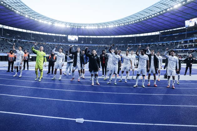 Sport, Football, 2 Bundesliga Season 2025 2026 15 Matchday Hertha BSC Berlin 1 FC Magdeburg 07 12 2025, Olympiastadion Berlin The players of 1 FC Magdeburg celebrate the victory after the match with the fans who traveled with them Berlin Olympiastadion Berlin Berlin Germany