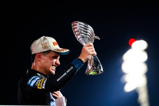 F1 - ABU DHABI GRAND PRIX 2025 04 NORRIS Lando (gbr), McLaren F1 Team MCL39, action celebrating the World Championship, WM, Weltmeisterschaft title on the podium with the trophy during the 2025 Formula 1 Abu Dhabi Grand Prix, 24th round of the 2025 FIA Formula One World Championship from December 05 to 07, 2025 on the Yas Marina Circuit, in Abu Dhabi, United Arab Emirates - Abu DhabiUnited Arab Emirates  Copyright: xFLORENTxGOODENx