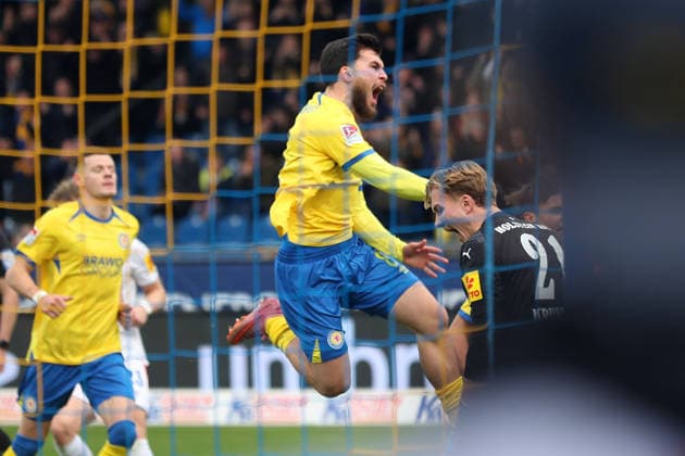 Braunschweig vs Kiel, 2 BL Braunschweig, 07 12 2025, FOOTBALL Eintracht Braunschweig vs Holstein Kiel, 2 BL, Season 2025 26 Mehmet Can Aydin Eintracht Braunschweig celebrates with teammates after his penalty goal to make it 1 0 Braunschweig
