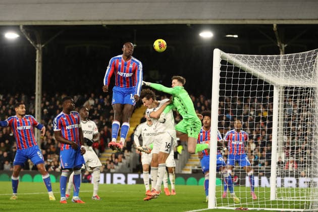 7th December 2025; Craven Cottage, Fulham, London, England; Premier League Football, Fulham versus Crystal Palace; goalkeeper Dean Henderson of Crystal Palace punches while being fouled by Sander Berge of Fulham  KatiexChan