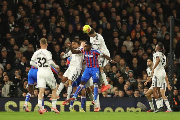 7th December 2025; Craven Cottage, Fulham, London, England; Premier League Football, Fulham versus Crystal Palace; Joachim Andersen of Fulham jumps over Marc Guehi of Crystal Palace and Kenny Tete of Fulham to win a header  KatiexChan