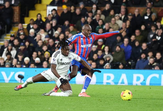 London, England, 7th December 2025. Calvin Bassey of Fulham (l) tussles with Jean Philippe Matate of Crystal Palace (r) during the Fulham vs Crystal Palace Premier League match at Craven Cottage, London. Picture credit should read: David Klein Sportimage EDITORIAL USE ONLY. No use with unauthorised audio, video, data, fixture lists, club league logos or live services. Online in-match use limited to 120 images, no video emulation. No use in betting, games or single club league player publications. SPI_032_DK_Fulham_Palace SPI-4355-0031