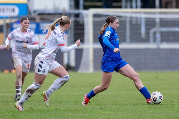 from left Eszter Reszler FC Bayern München II, 2 and Laura Bröring SV Meppen, 6 in a duel, dynamic, action, action, game scene, THE DFB REGULATIONS PROHIBIT ANY USE OF PHOTOGRAPHS AS IMAGE SEQUENCES AND OR QUASI VIDEO , 07 12 2025, Meppen Germany , Football, 2 Womens Bundesliga, SV Meppen FC Bayern München II xobx
