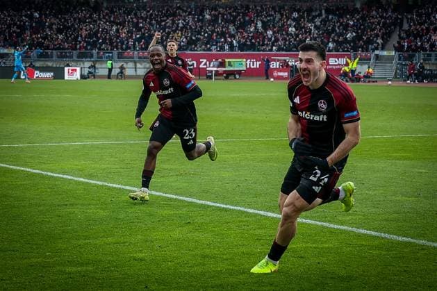 Luca Lochosvili 24 1FC Nuernberg , right, runs jubilantly to the fans after his goal for 1 0, with Mohamed Ali Zoma 23 1FC Nuernberg , Emotion, joy, 1 FC Nuernberg vs Spvgg Greuther Fuerth, Football, 2 Bundesliga, DFL, Season 2025 2026, Hinrunde, 15 Matchday, 07 12 2025 DFB regulations prohibit any use of photographs as image sequences and or quasi video Nuernberg Bayern Germany Copyright: xkolbert-press MartinxAgüerax