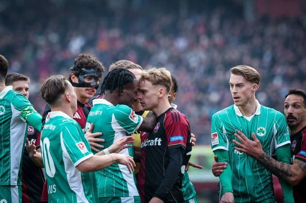 The two teams scuffle as Noel Futkeu 9 Spvgg Greuther Fuerth and Tim Janisch 32 1FC Nuernberg clash, with Felix Klaus 30 Spvgg Greuther Fuerth , Fabio Gruber 4 1FC Nuernberg and Luca Itter 27 Spvgg Greuther Fuerth and Adriano Grimaldi 33 1FC Nuernberg , 1 FC Nuernberg vs Spvgg Greuther Fuerth, Football, 2 Bundesliga, DFL, Saison 2025 2026, Hinrunde, 15 Spieltag, 07 12 2025 DFB regulations prohibit any use of photographs as image sequences and or quasi video Nuernberg Bayern Germany Copyright: xkolbert-press MartinxAgüerax