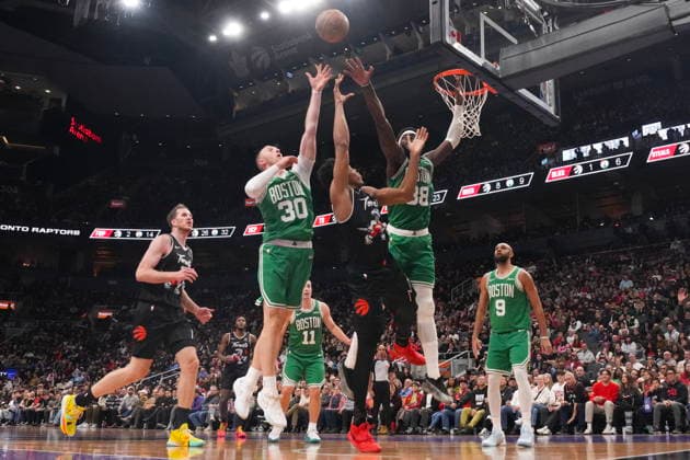 December 7, 2025, Toronto, On, CANADA: Toronto Raptors forward Scottie Barnes (4) shoots over Boston Celtics Sam Hauser (30) and Neemias Queta (88) during first half NBA, Basketball Herren, USA basketball action in Toronto on Sunday December 7, 2025. Scottie Barnes; Sam Hauser; Neemias Queta  - ZUMAc35_ 20251207_zaf_c35_076 Copyright: xChrisxYoungx