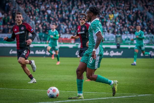Noel Futkeu 9 Spvgg Greuther Fuerth in action against Adam Markhiyev 6 1FC Nuernberg , 1 FC Nuernberg vs Spvgg Greuther Fuerth, Fußball, 2 Bundesliga, DFL, Saison 2025 2026, Hinrunde, 15 Spieltag, 07 12 2025 DFB regulations prohibit any use of photographs as image sequences and or quasi video Nuernberg Bayern Germany Copyright: xkolbert-press MartinxAgüerax