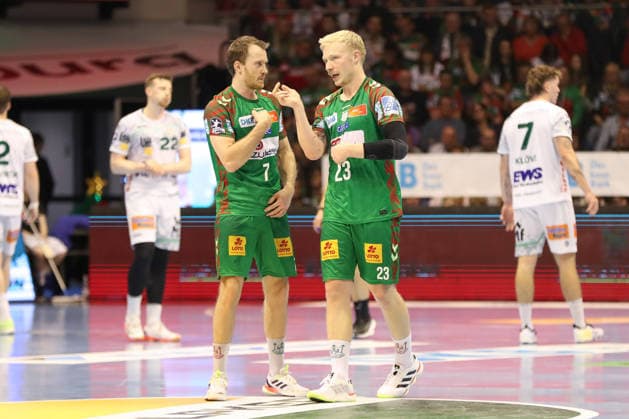 07 12 2025, xgox, Handball Daikin HBL SC Magdeburg FRISCH AUF Göppingen emspor, v l Felix Claar Magdeburg, 7 , Magnus Saugstrup Magdeburg, 23 in conversation Magdeburg