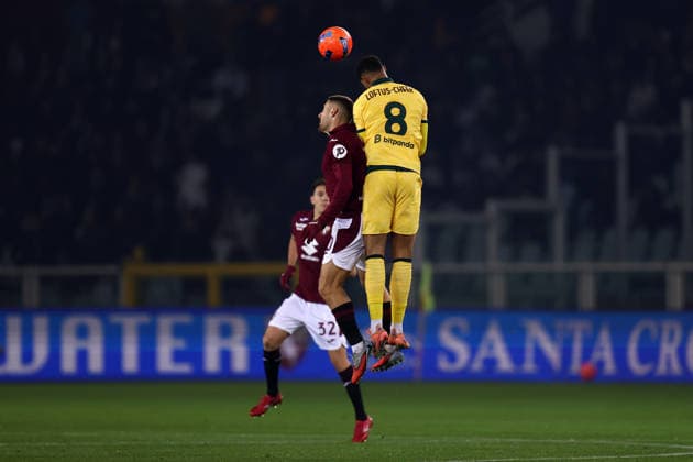 Nikola Vlasic (Torino Fc) und Ruben Loftus-Cheek (Ac Milan) battle for the ball, Serie A, Torino FC v Ac Milan, Olimpico, December 8, 2025, Turin, Italy.