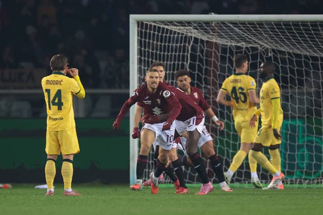 Turin, Italy, 8th December 2025. Nikola Vlasic of Torino FC celebrates with team mates after scoring a penalty to give the hosts a 1-0 lead during the Torino vs AC Milan Serie A match at Stadio Grande Torino, Turin. Picture credit should read: Jonathan Moscrop Sportimage EDITORIAL USE ONLY. No use with unauthorised audio, video, data, fixture lists, club league logos or live services. Online in-match use limited to 120 images, no video emulation. No use in betting, games or single club league player publications. SPI_003_JM_TORO_MILAN SPI-4323-0003