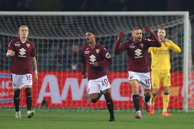 Turin, Italy, 8th December 2025. Nikola Vlasic of Torino FC celebrates with team mates after scoring a penalty to give the hosts a 1-0 lead during the Torino vs AC Milan Serie A match at Stadio Grande Torino, Turin. Picture credit should read: Jonathan Moscrop Sportimage EDITORIAL USE ONLY. No use with unauthorised audio, video, data, fixture lists, club league logos or live services. Online in-match use limited to 120 images, no video emulation. No use in betting, games or single club league player publications. SPI_010_JM_TORO_MILAN SPI-4323-0010