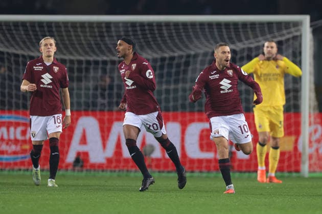 Turin, Italy, 8th December 2025. Nikola Vlasic of Torino FC celebrates with team mates after scoring a penalty to give the hosts a 1-0 lead during the Torino vs AC Milan Serie A match at Stadio Grande Torino, Turin. Picture credit should read: Jonathan Moscrop Sportimage EDITORIAL USE ONLY. No use with unauthorised audio, video, data, fixture lists, club league logos or live services. Online in-match use limited to 120 images, no video emulation. No use in betting, games or single club league player publications. SPI_011_JM_TORO_MILAN SPI-4323-0011