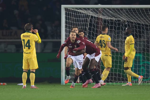Turin, Italy, 8th December 2025. Nikola Vlasic of Torino FC celebrates with team mates after scoring a penalty to give the hosts a 1-0 lead during the Torino vs AC Milan Serie A match at Stadio Grande Torino, Turin. Picture credit should read: Jonathan Moscrop Sportimage EDITORIAL USE ONLY. No use with unauthorised audio, video, data, fixture lists, club league logos or live services. Online in-match use limited to 120 images, no video emulation. No use in betting, games or single club league player publications. SPI_020_JM_TORO_MILAN SPI-4323-0020