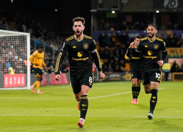 Wolverhampton, England, 8th December 2025. Bruno Fernandes of Manchester United, ManU celebrates scoring the first goal during the Wolverhampton Wanderers vs Manchester United Premier League match at Molineux, Wolverhampton. Picture credit should read: Andrew Yates Sportimage EDITORIAL USE ONLY. No use with unauthorised audio, video, data, fixture lists, club league logos or live services. Online in-match use limited to 120 images, no video emulation. No use in betting, games or single club league player publications. SPI_052_AY_Wolves_Man_Utd SPI-4356-0052