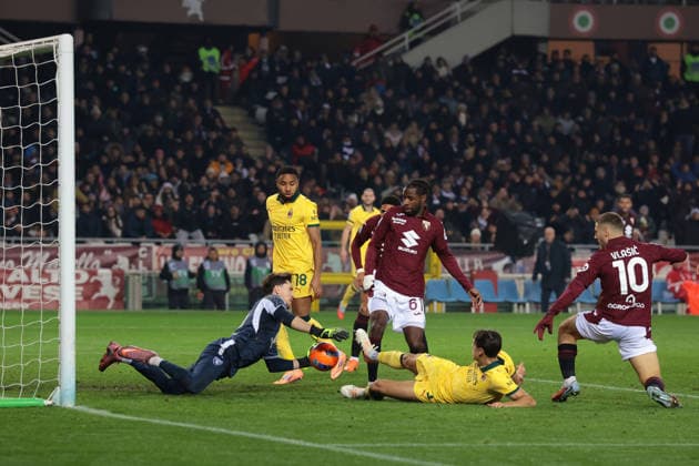 Turin, Italy, 8th December 2025. Samuele Ricci of AC Milan is denied a goal by Franco Israel of Torino FC during the Torino vs AC Milan Serie A match at Stadio Grande Torino, Turin. Picture credit should read: Jonathan Moscrop Sportimage EDITORIAL USE ONLY. No use with unauthorised audio, video, data, fixture lists, club league logos or live services. Online in-match use limited to 120 images, no video emulation. No use in betting, games or single club league player publications. SPI_055_JM_TORO_MILAN SPI-4323-0055