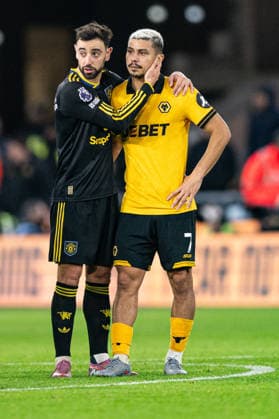 8th December 2025; Molineux Stadium, Wolverhampton, West Midlands, England; Premier League Football, Wolverhampton Wanderers versus Manchester United, ManU Bruno Fernandes of Manchester United commiserates with Andre of Wolverhampton Wanderers after the final whistle Editorial use only: DataCo restrictions apply See www.football-dataco.com  GodfreyxPitt