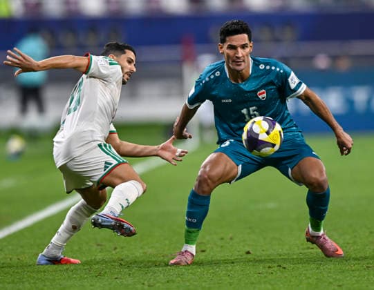 Algeria v Iraq : FIFA Arab Cup 2025 Youcef Atal of Algeria and Ahmed Yahya of Iraq in action during the Group D FIFA Arab Cup 2025 match between Algeria and Iraq at Khalifa International Stadium in Doha, Qatar, on December 09, 2025. DOHA Qatar Copyright: xNOUSHADxTHEKKAYILx