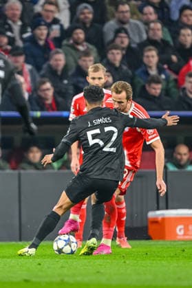 Joao Simoes Sporting CP and Harry Kane FC Bayern München battle for the ball during the UEFA Champions League 2025 26 League Phase MD6 match between FC Bayern München and Sporting Clube de Portugal at Football Arena Munich on December 9, 2025 in Munich, Germany Photo by xxx DeFodi Images