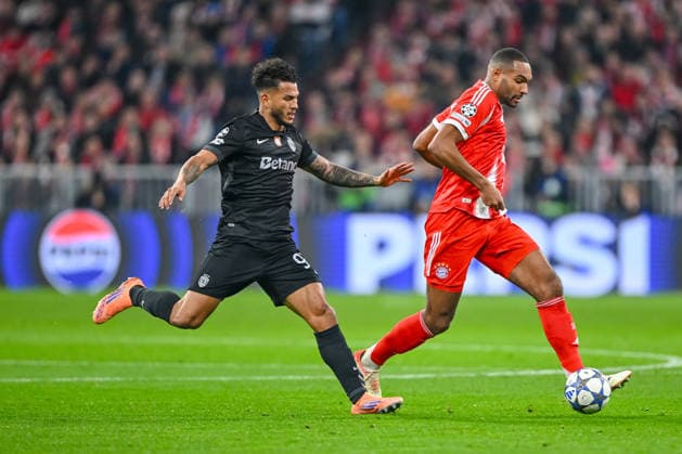 Luis Suarez Sporting CP and Jonathan Tah FC Bayern München battle for the ball during the UEFA Champions League 2025 26 League Phase MD6 match between FC Bayern München and Sporting Clube de Portugal at Football Arena Munich on December 9, 2025 in Munich, Germany Photo by xxx DeFodi Images