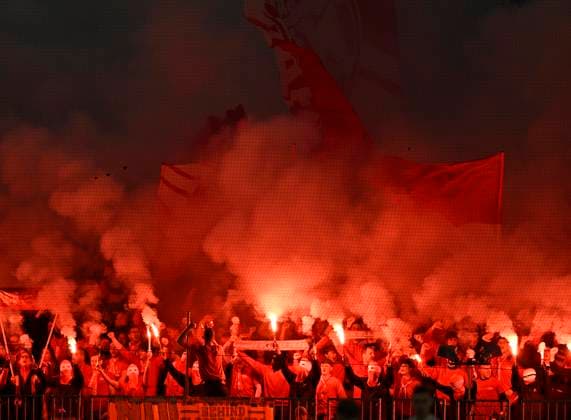 09 12 2025, Football UEFA Championsleague 2025 2026 Preliminary Round 6 Matchday, FC Bayern Munich Sporting Lisbon, in the Allianz Arena Munich The Bavarians in the South Curve have ignited Phyros DFL and DFB regulations prohibit any use of photographs as image sequences and or quasi video