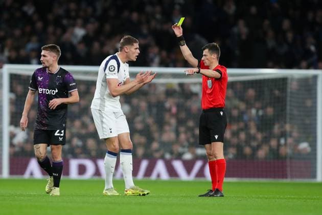 Micky van de Ven of Tottenham Hotspur receives a yellow card from the referee Tottenham Hotspur v SK Slavia Praha, Football, UEFA Champions League 2025 26 League Phase MD6, Tottenham Hotspur Stadium, London, UK, 09 12 25 Editorial use only  Copyright: xAnthonyxHanc Shutterstockx 16066670a