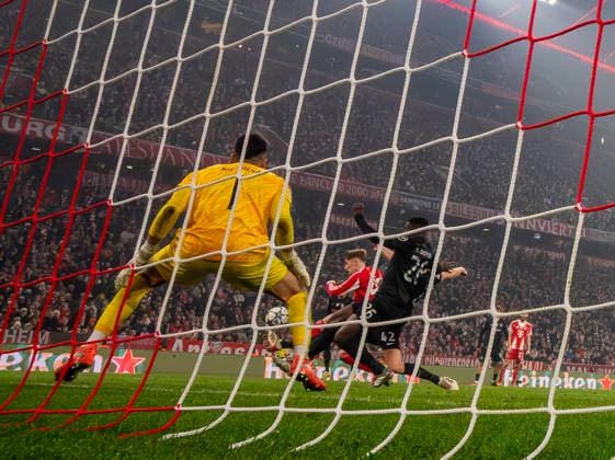 09 12 2025, Football UEFA Championsleague 2025 2026 Preliminary Round 6 Matchday, FC Bayern Munich Sporting Lisbon, at Allianz Arena Munich Lennart Karl FC Bayern Munich scores to 2 1 against goalkeeper Rui Silva Sporting Lisbon DFL and DFB regulations prohibit any use of photographs as image sequences and or quasi video