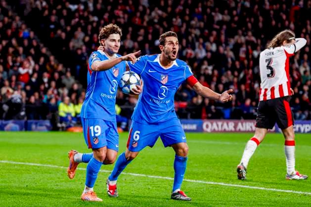 Julian Alvarez of Atletico Madrid celebrate their team s first goal with Koke of Atletico Madrid and Yarek Gasiorowski of PSV Eindhoven looks dejected after conceding his sides first goal PSV Eindhoven v Atletico de Madrid, UEFA Champions League 2025 26 League Phase MD6, PSV Eindhoven v Atletico de Madrid, PSV Stadion, December 9, 2025, Eindhoven, Netherlands.